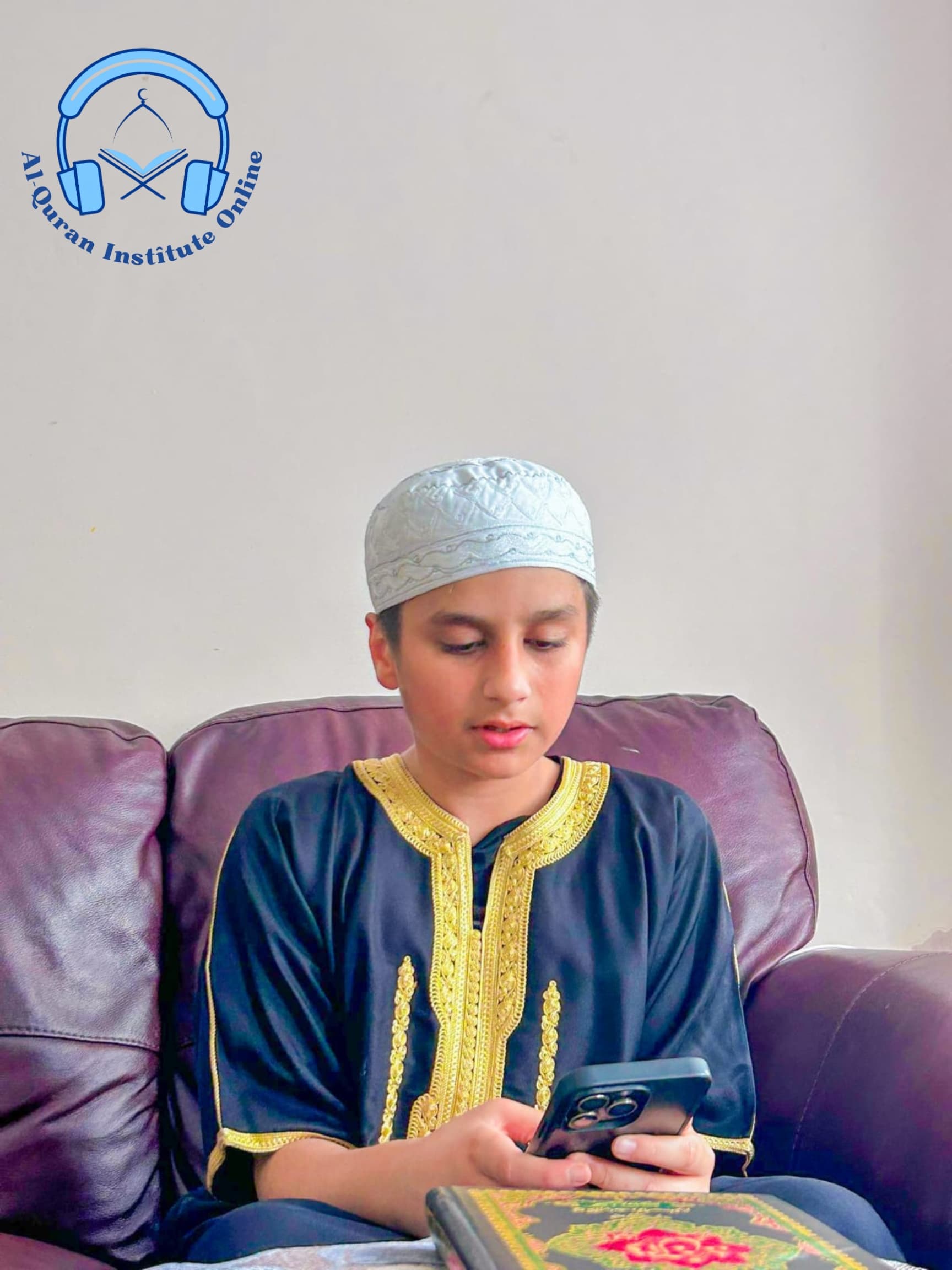 Young student taking an online Quran lesson on a smartphone at home